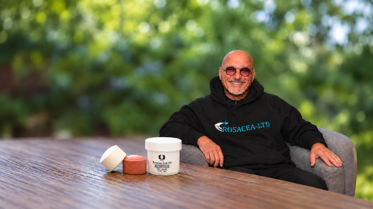 Howie Mandel sits beside Rosacea-LTD product jars in a promotional graphic for its patented mineral disc. 