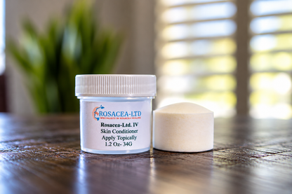 White ROSACEA-LTD mineral disc beside its labeled skin conditioner jar on a wooden surface.