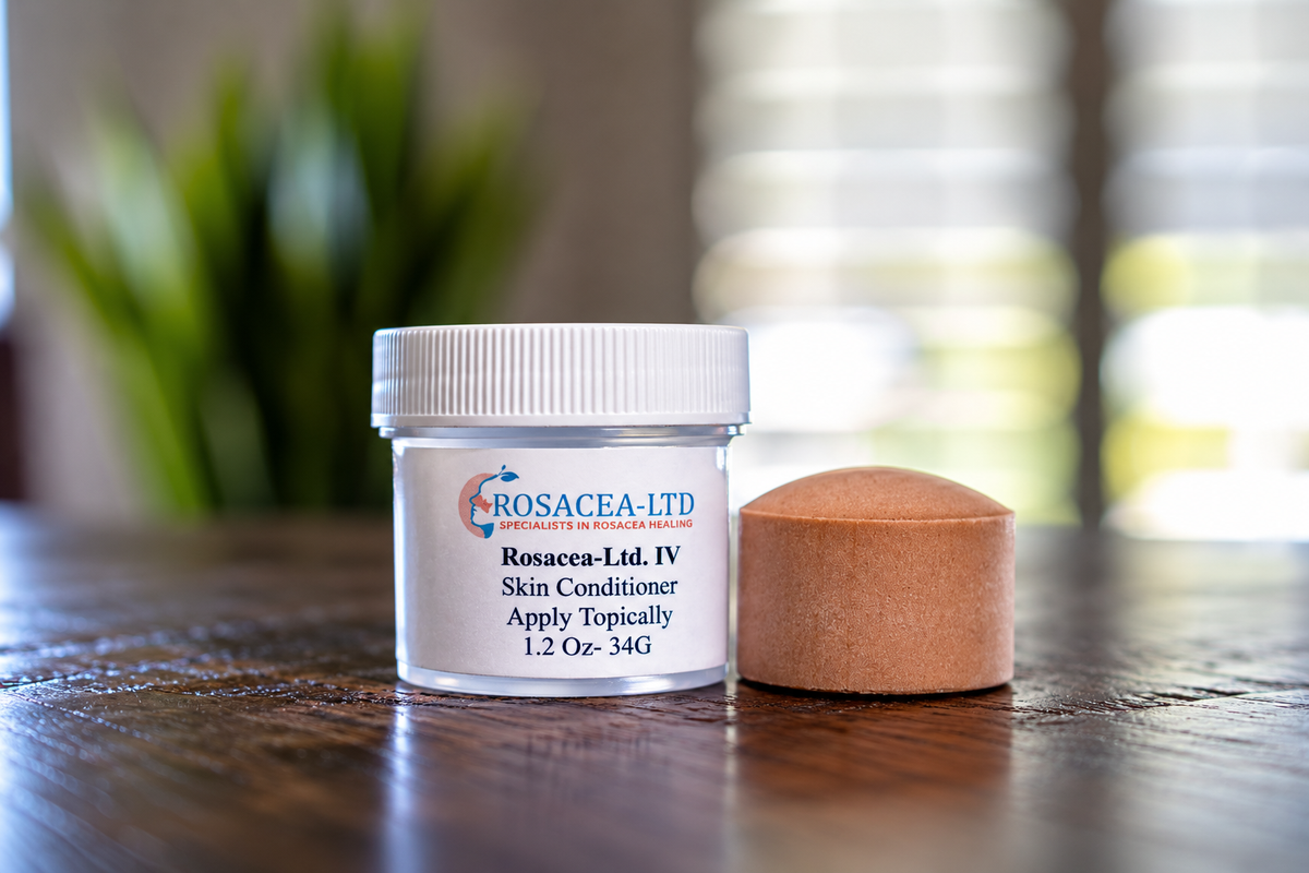 Brown ROSACEA-LTD mineral disc beside its labeled skin conditioner jar on a wooden surface.